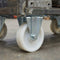 200mm Pressed Steel Fixed Castor with White Nylon Wheel, 4-Hole Top Plate - 230kg Load Capacity