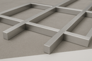 Intersecting brushed aluminum rectangular bars arranged in a grid pattern on a flat surface