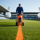 Orange GrassMark Premium Grass Line Marking Paint in use on sports pitch | IndtriLine