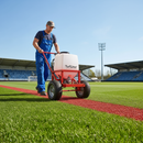 Red GrassMark Premium Grass Line Marking Paint in use on sports pitch | IndtriLine