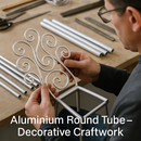 Person crafting decorative swirls from aluminum round tubes on a workbench
