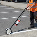 2-wheel aerosol line marking applicator in use on car park | IndtriLine