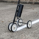 Close-up 4-wheel line marking applicator on concrete | IndtriLine