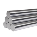Stack of polished stainless steel round bars on white background