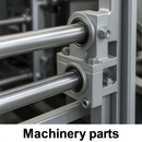 Close-up of metal rods with bearing housings in industrial machinery