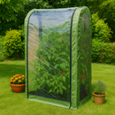 Compact green growhouse in garden with pepper plants inside.