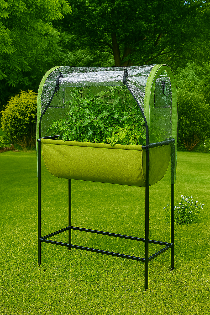Raised fabric planter with clear cover on lawn, full of leafy greens