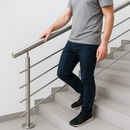 Person holding stainless steel handrail while walking down stairs