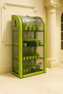 Bright green 4-tier mini greenhouse with clear cover on tiled patio.